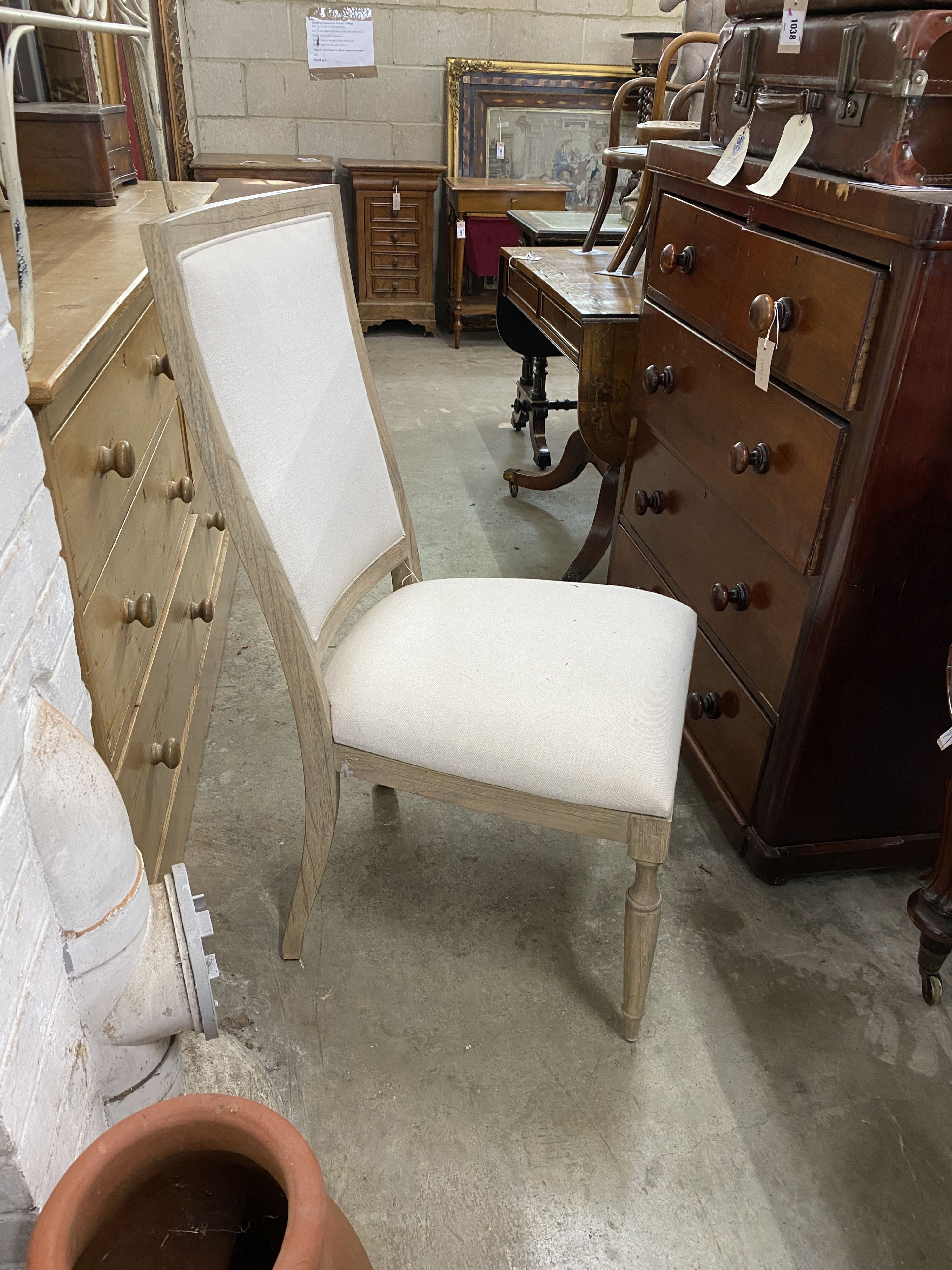 A pair of contemporary bleached oak “Riviera” upholstered high back dining chairs